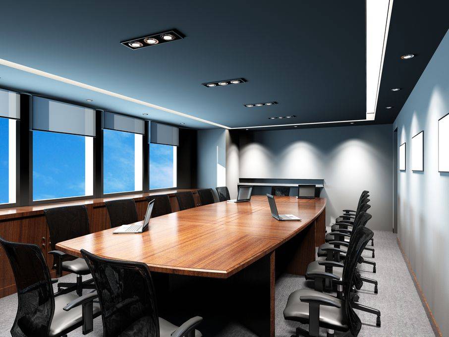 wood conference room table, windows and blue ceiling